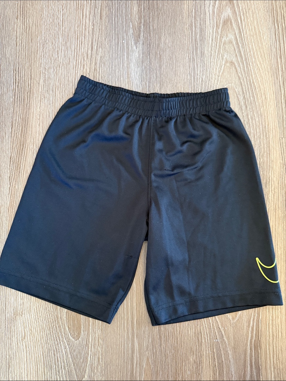 Boys Nike Black Athletic Shorts with Yellow Swoosh - size 7 (L)